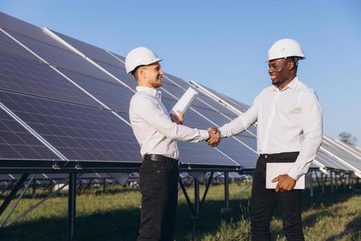 engineers-shaking-hands-at-solar-panel-installation-site-photo